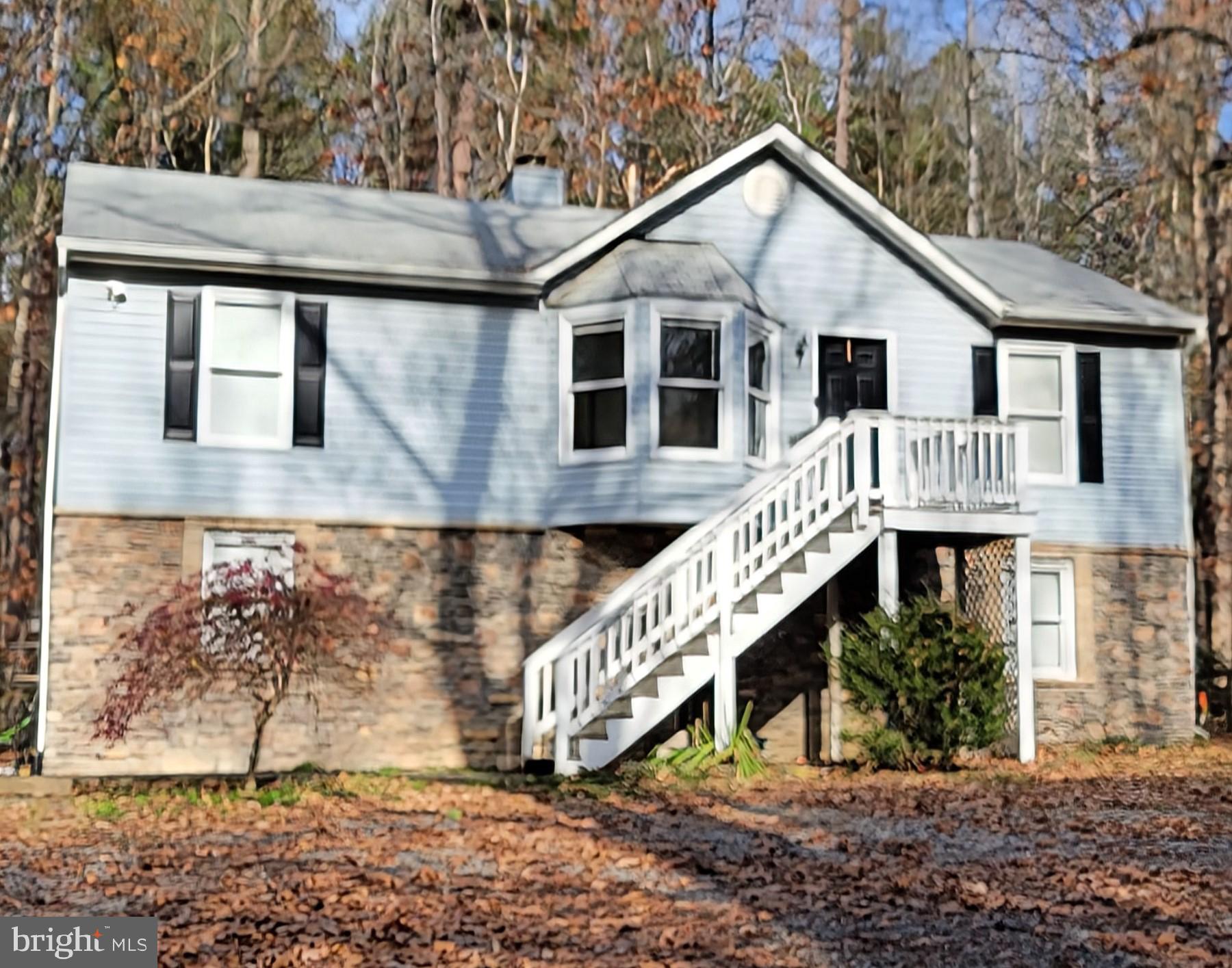 a front view of a house with a yard and balcony