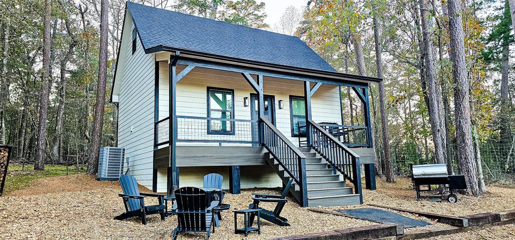 a view of wooden house with a iron stairs