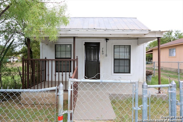 a front view of a house with a porch