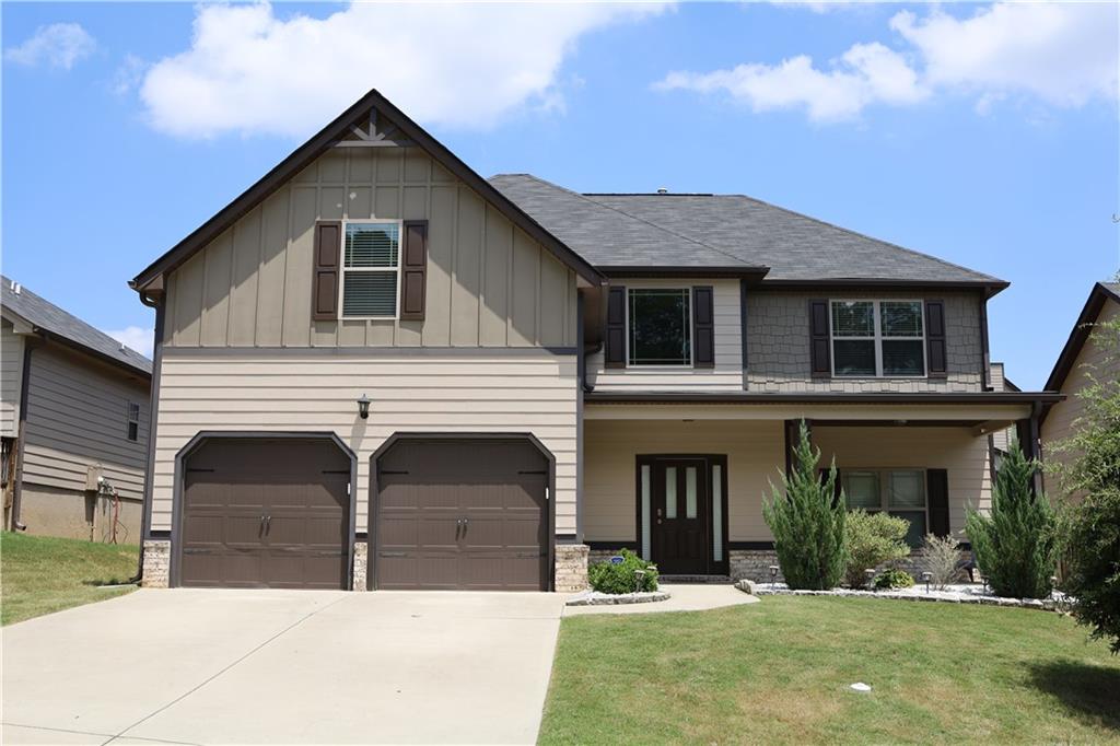 a front view of a house with a yard