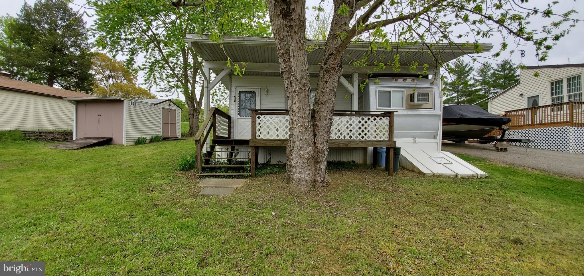 a view of backyard with a table and chairs