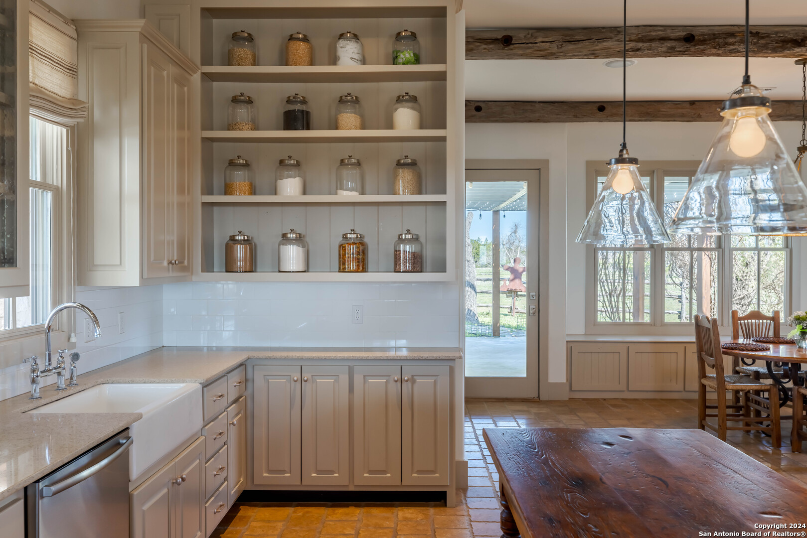 a kitchen with a sink cabinets and window