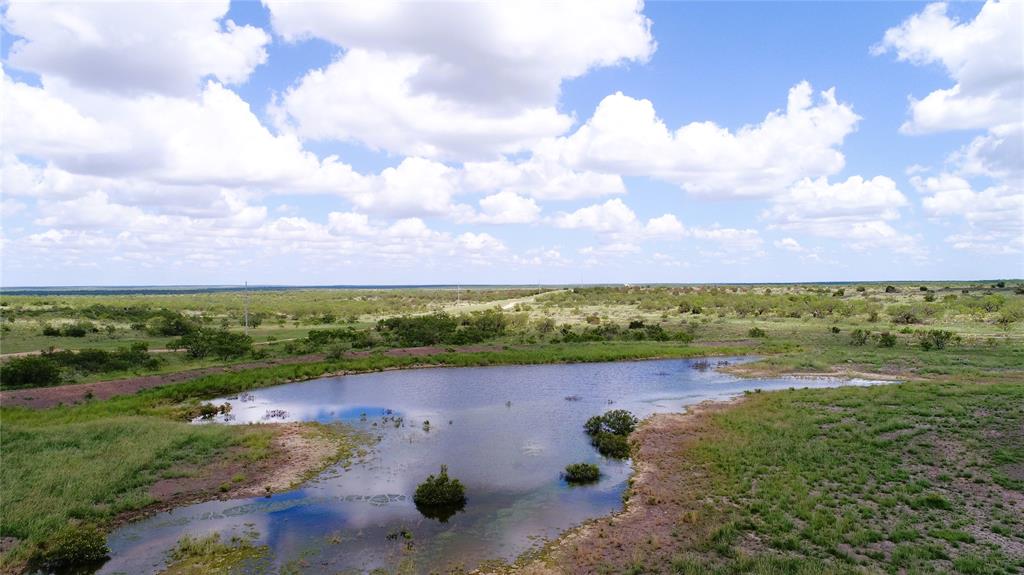 a view of a lake with a yard