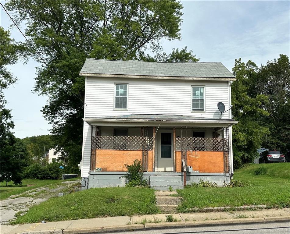 a view of house with yard