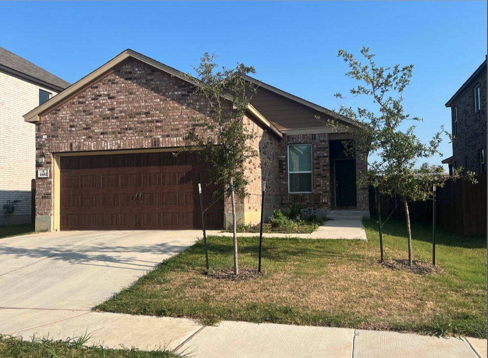 a view of a house with a yard