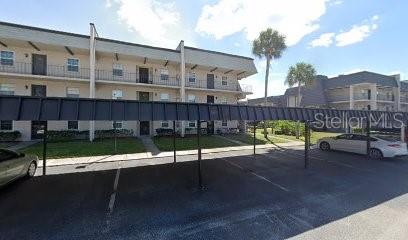 a view of swimming pool with outdoor seating and a buildings