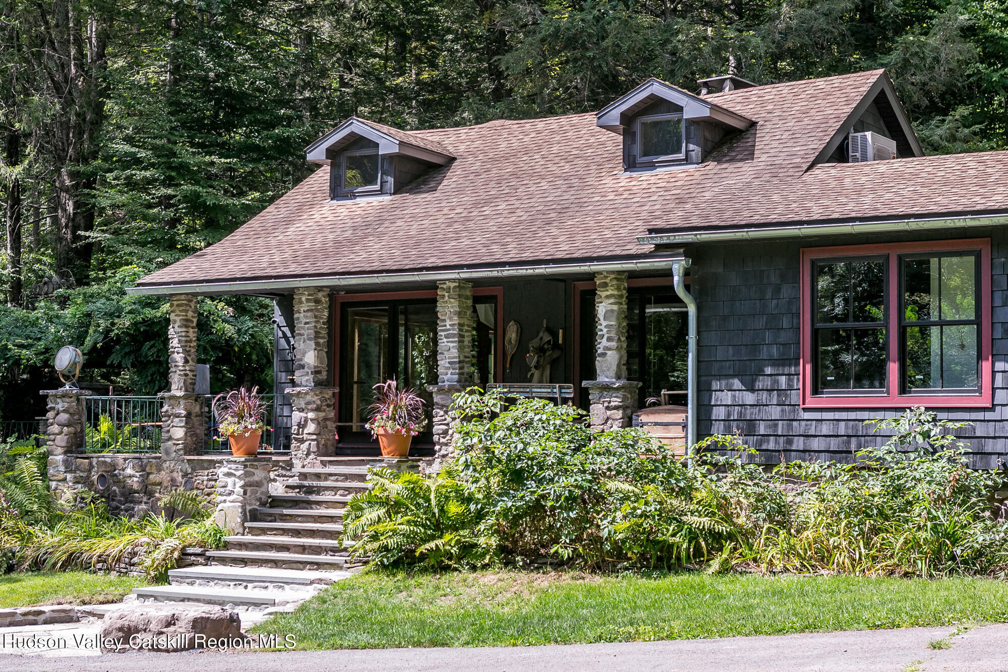 a front view of a house with garden