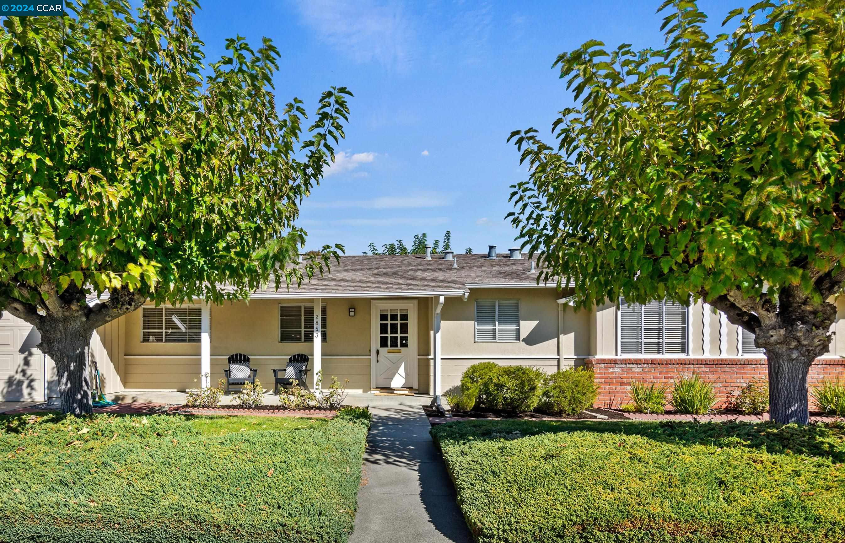 front view of a house with a yard