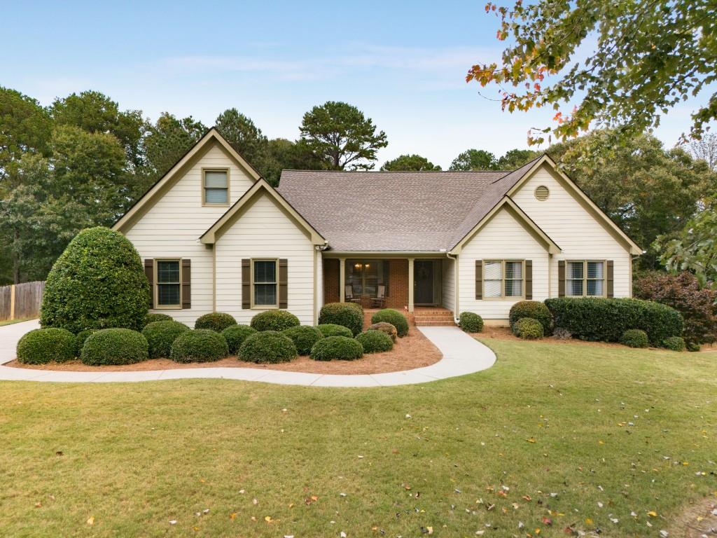 a front view of a house with a yard