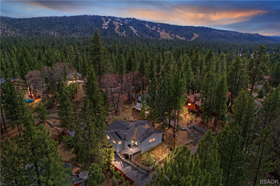 a view of a house with a mountain in the background