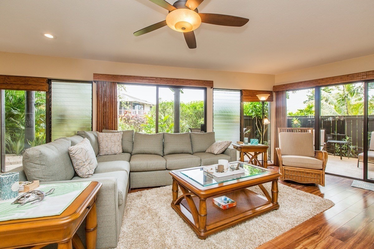 a living room with furniture and a large window