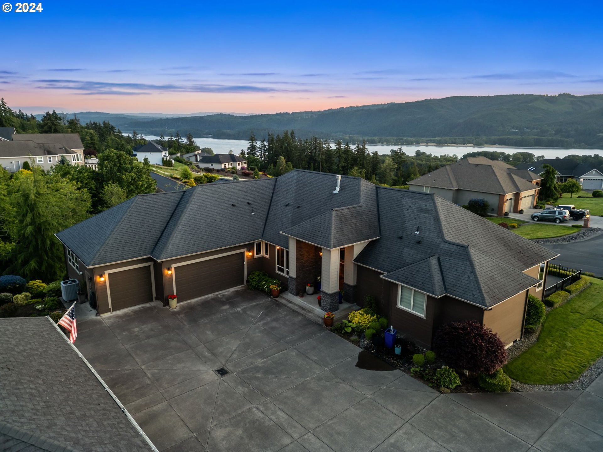 a aerial view of a house with a yard