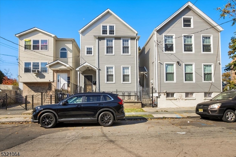 a car parked in front of a house