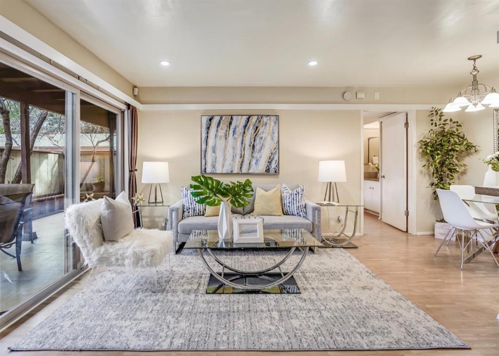 a living room with furniture and a rug