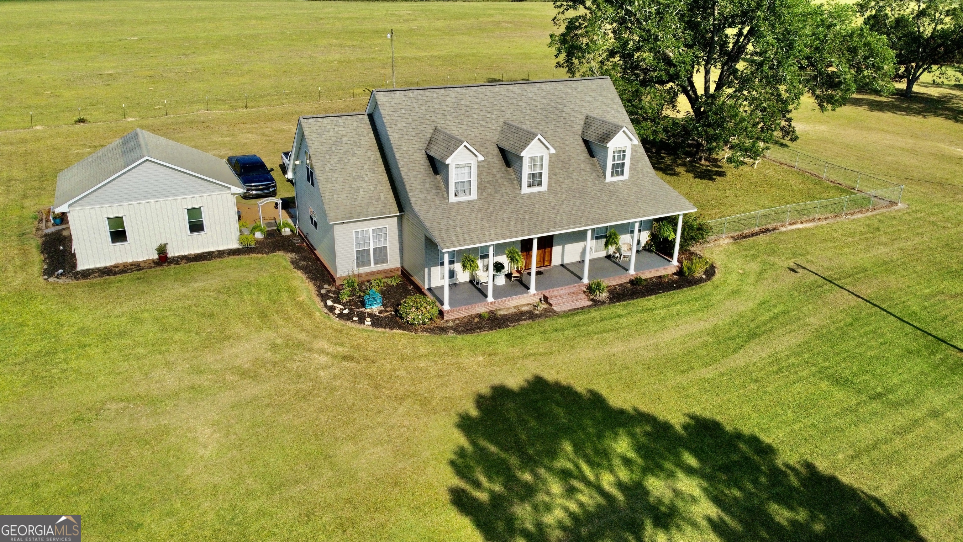 a aerial view of residential houses with outdoor space and swimming pool