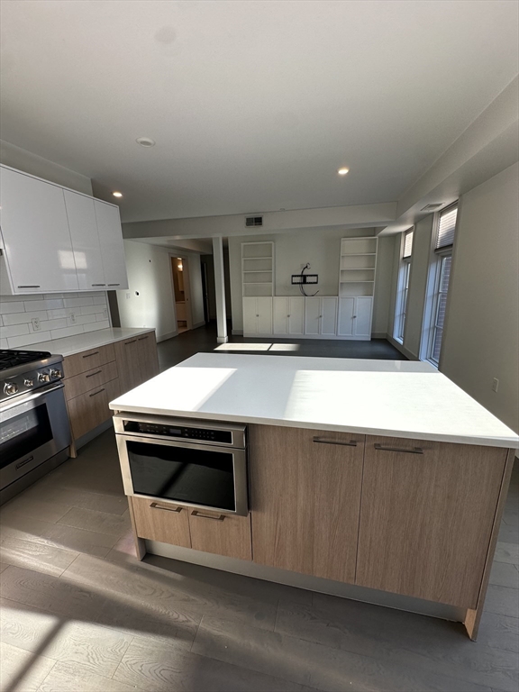 a kitchen with a stove and a sink