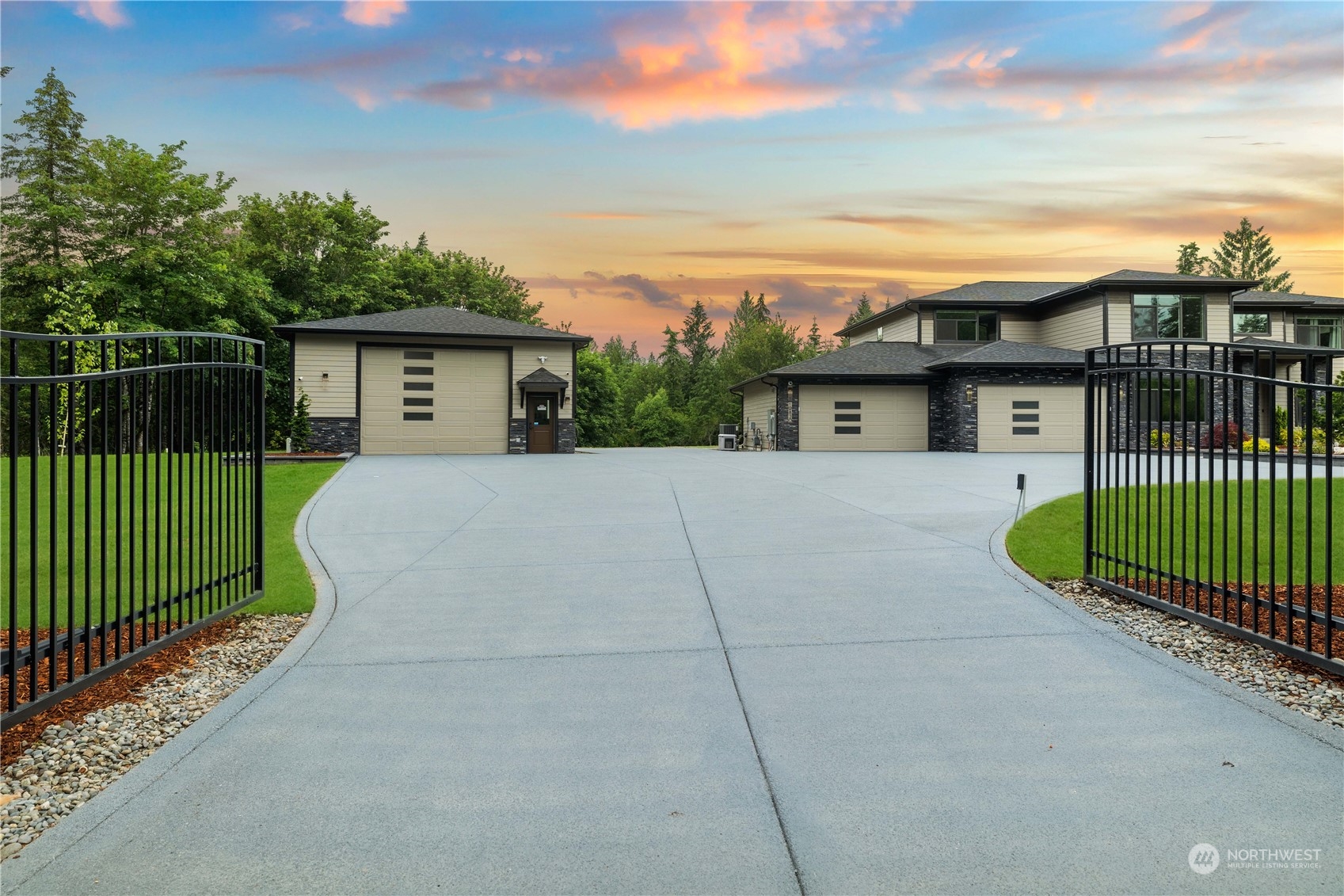 a view of a house with a wooden fence