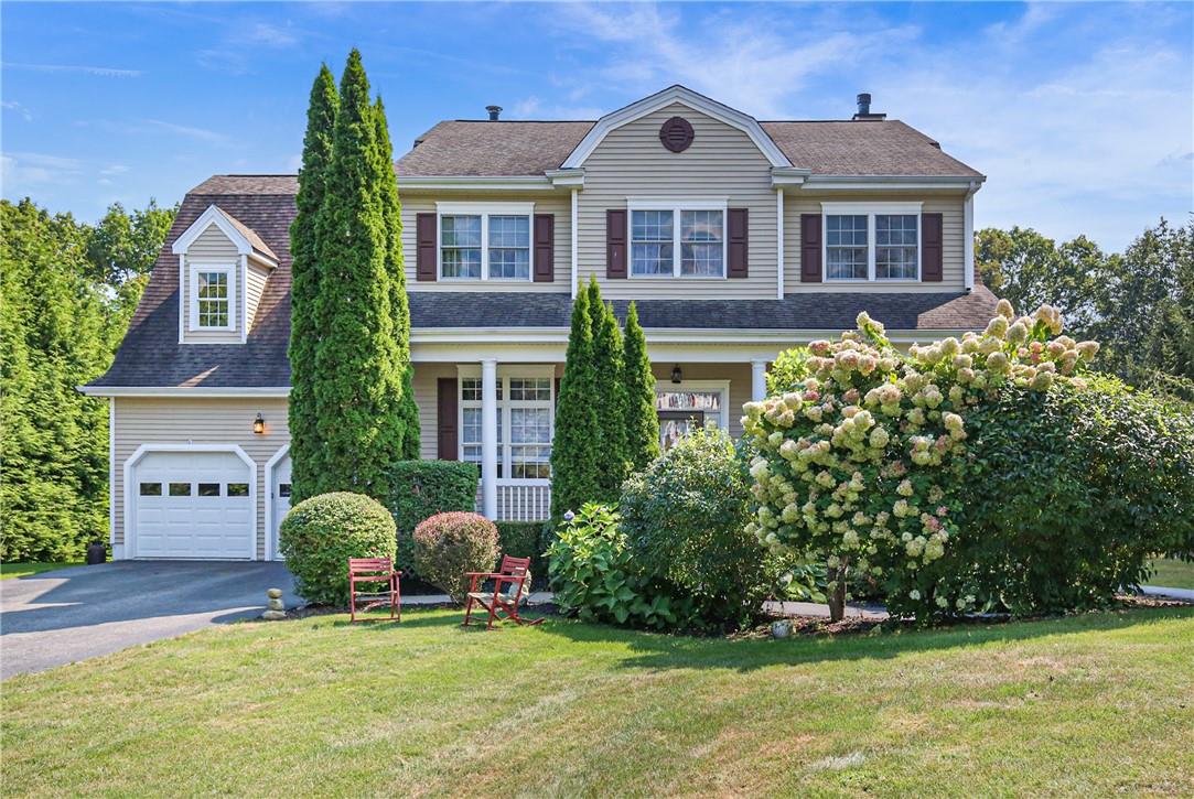 a front view of a house with garden