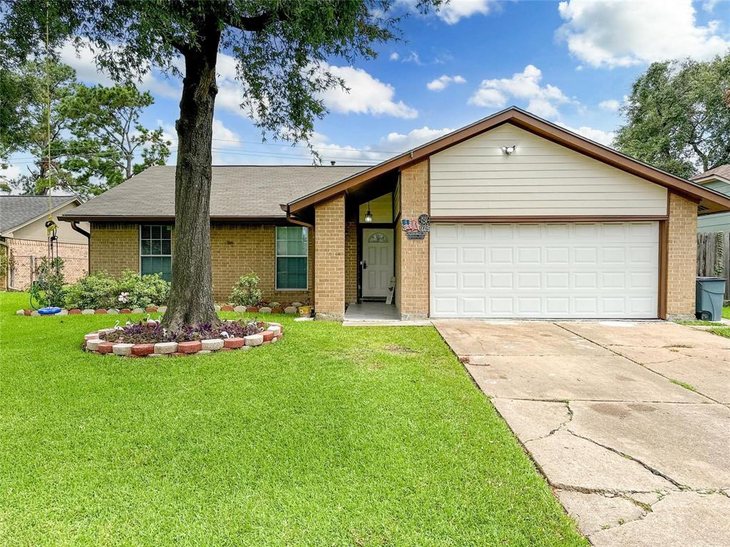 a front view of house with yard and outdoor seating