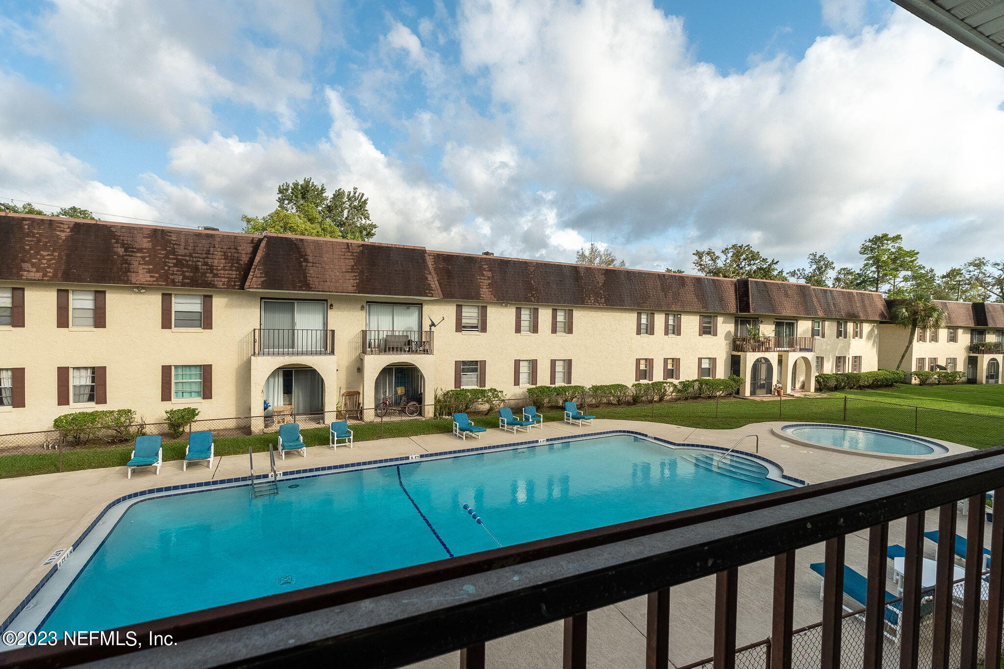 a view of swimming pool with outdoor seating