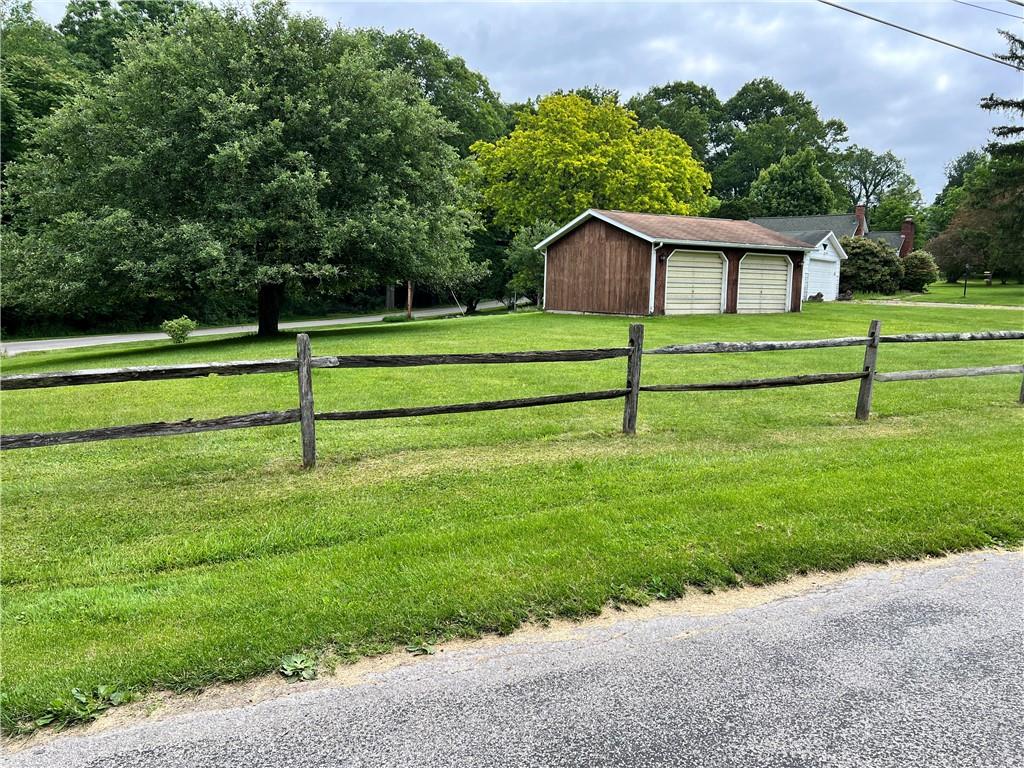 a view of house with backyard