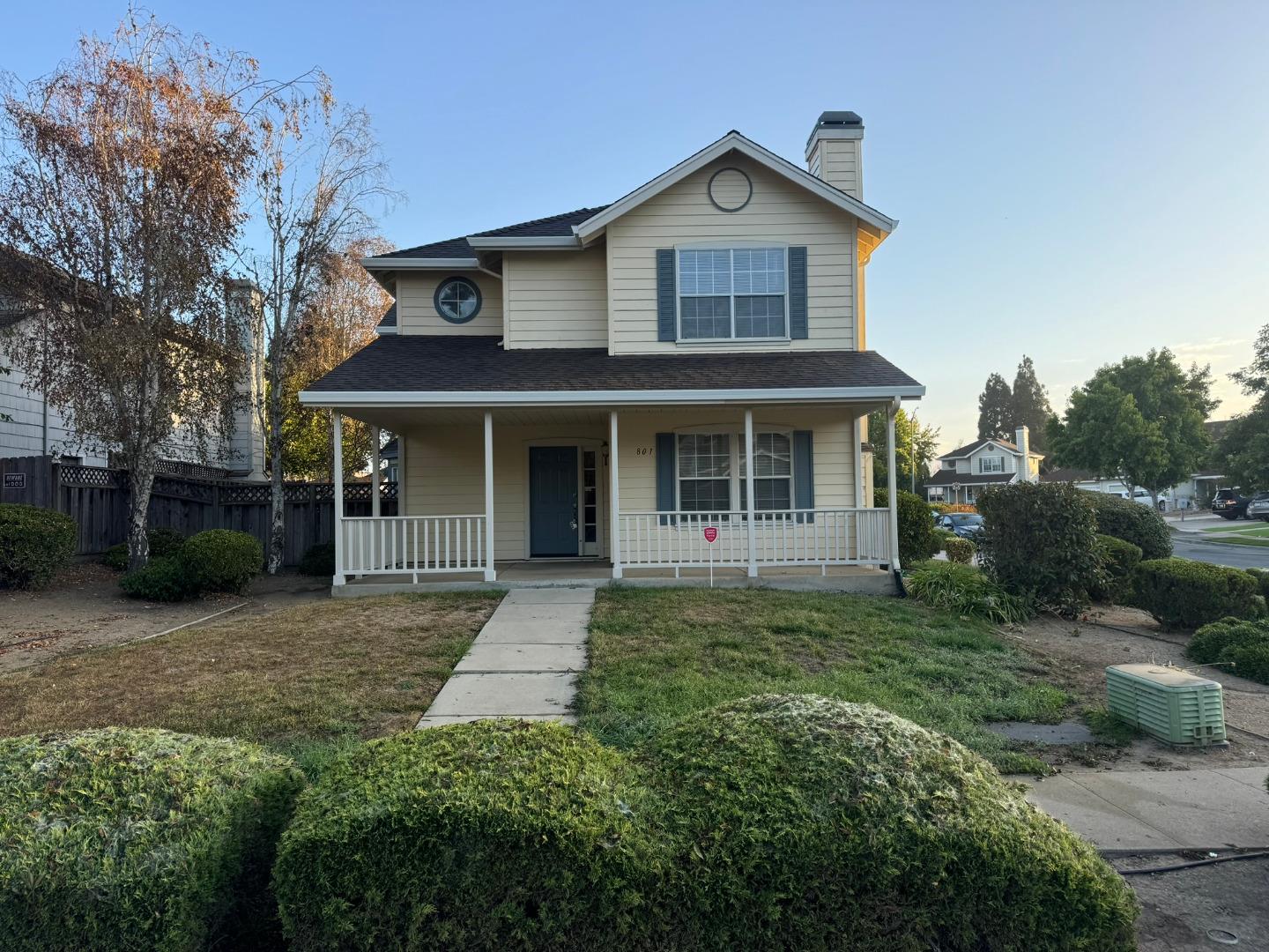 front view of a house with a yard