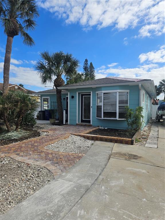 front view of a house with a yard