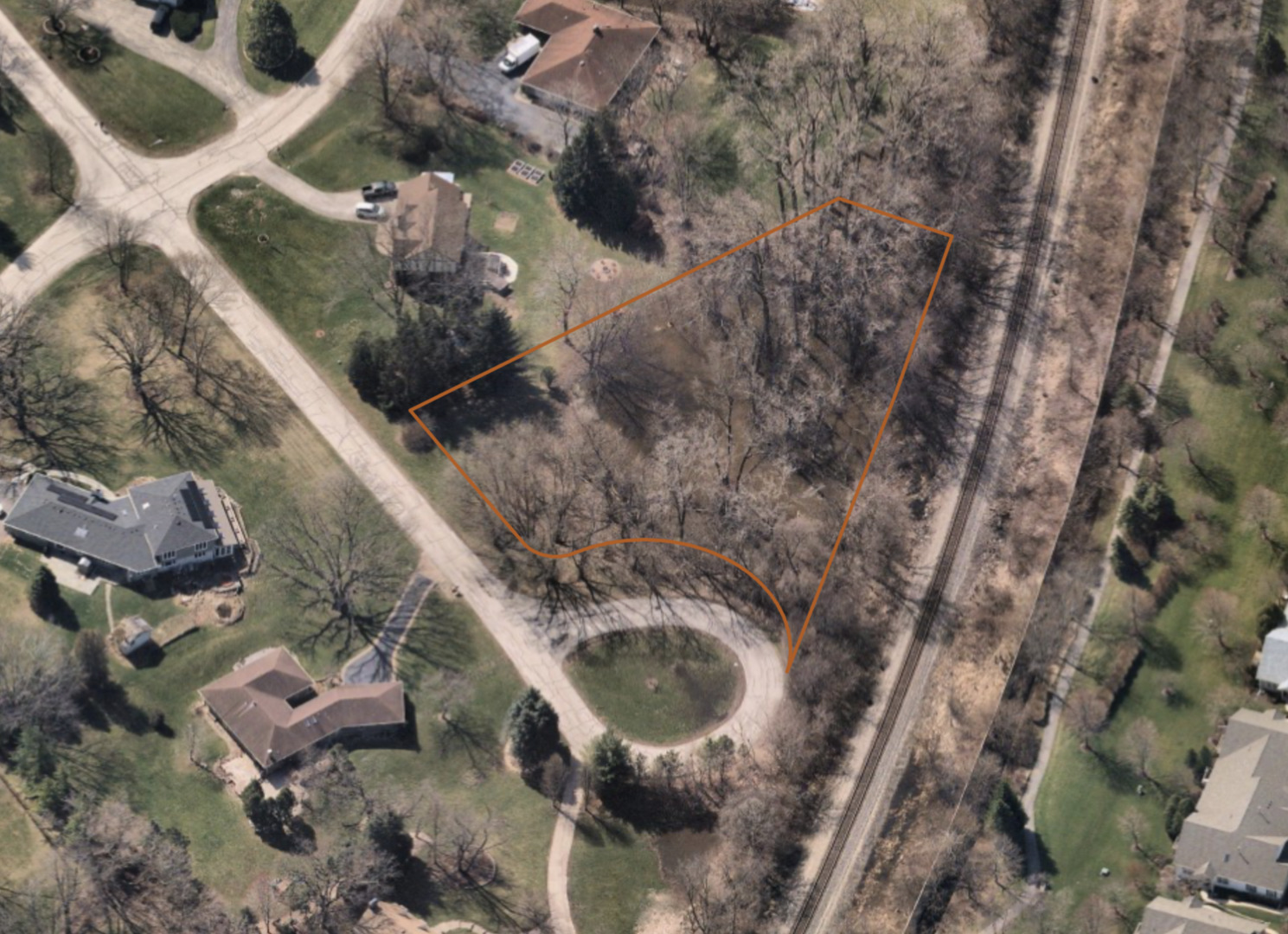 an aerial view of a house with outdoor space