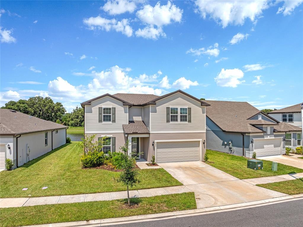 a front view of a house with a yard