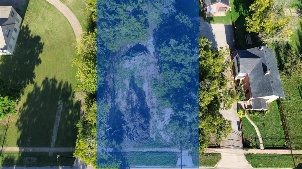 an aerial view of a house with a yard and garden