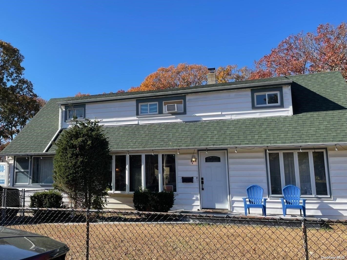 a front view of house with street