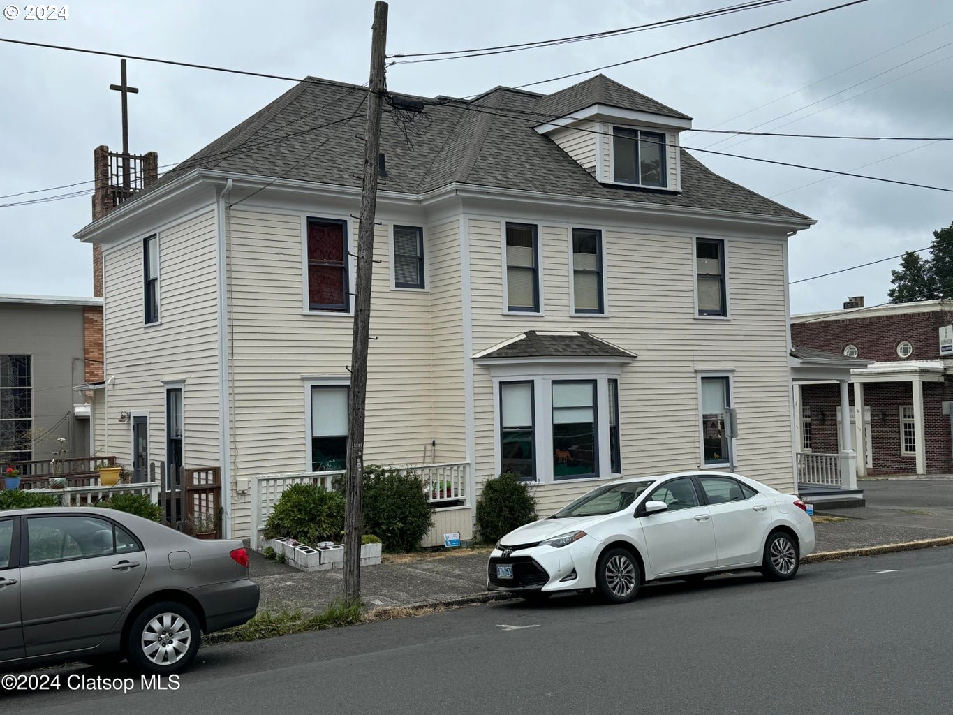 a view of a car parked in front of a house