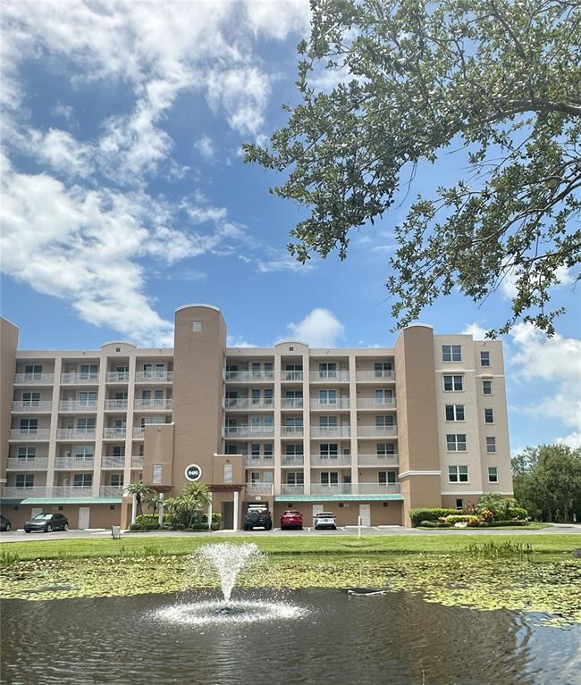 a front view of a building with a yard