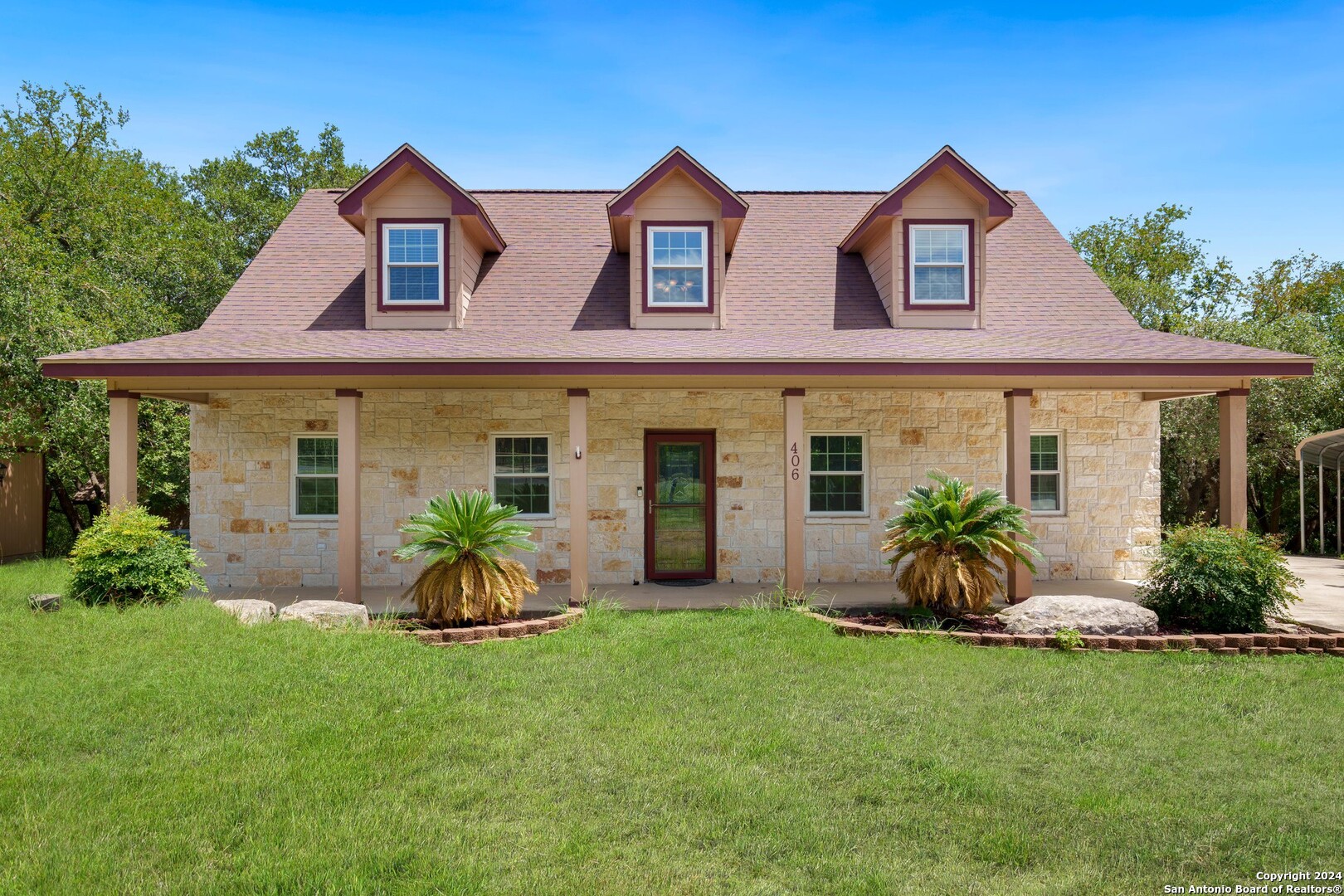 a front view of a house with a yard