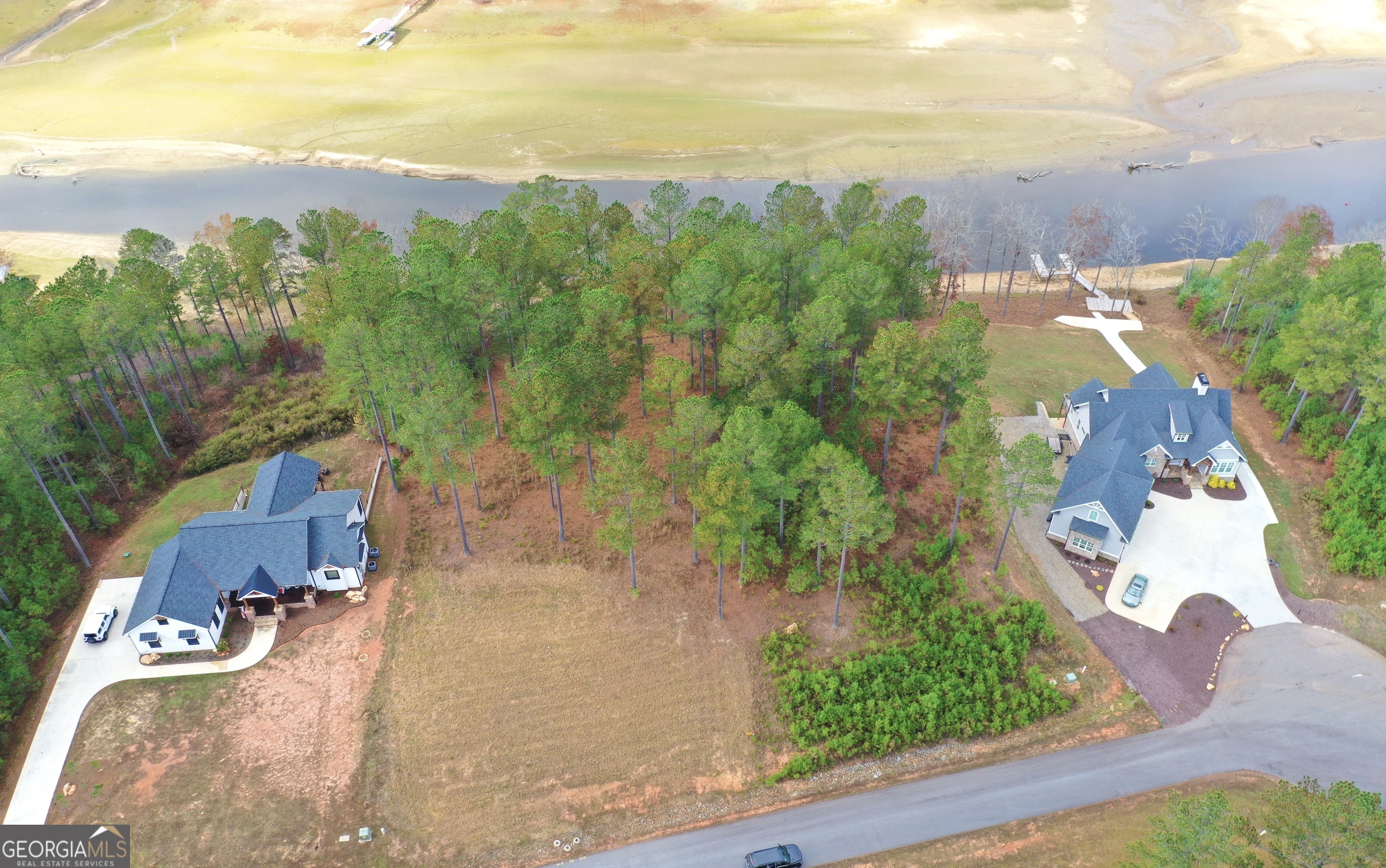 an aerial view of a house with yard swimming pool and outdoor seating