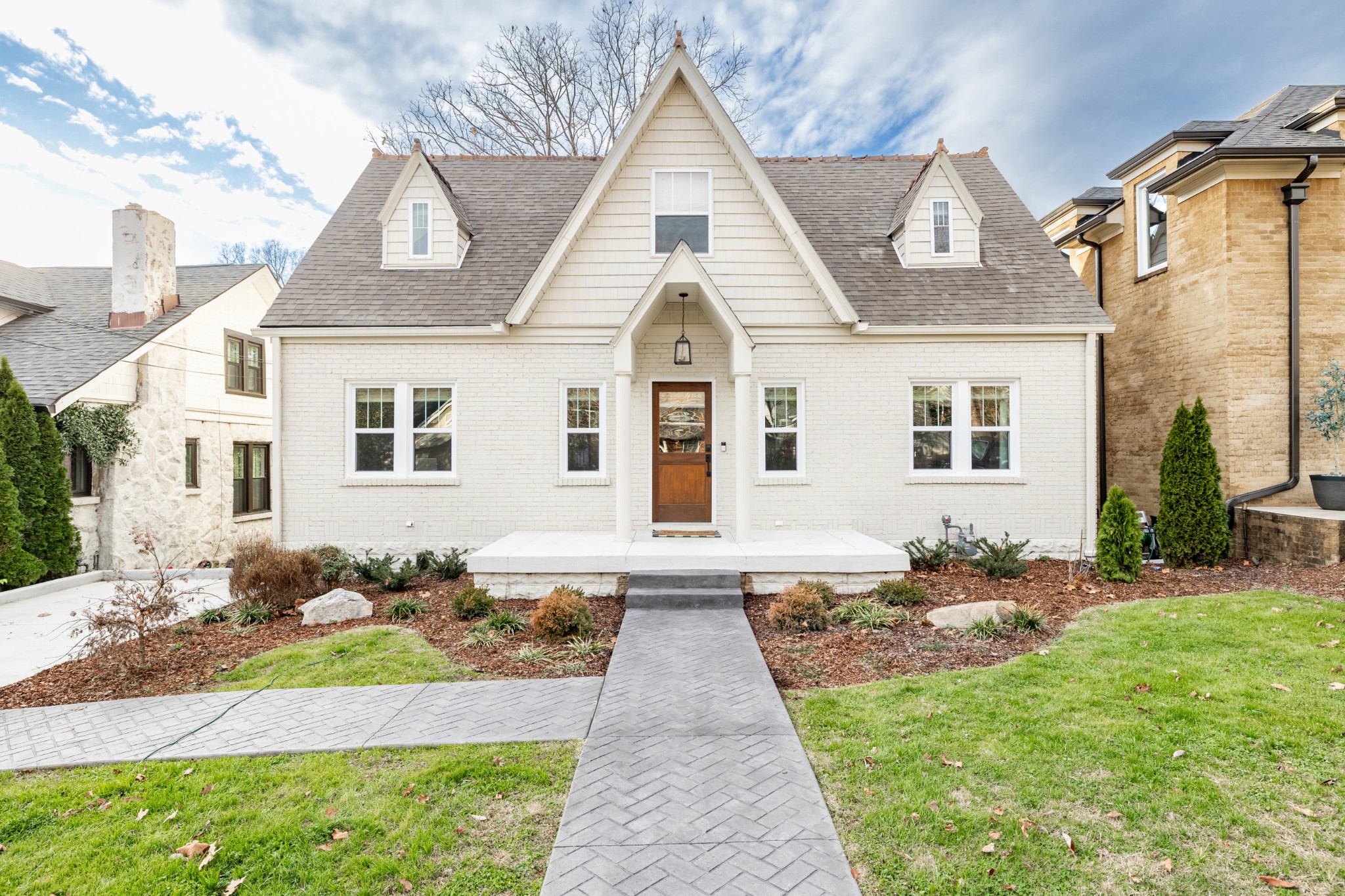 a front view of a house with a yard