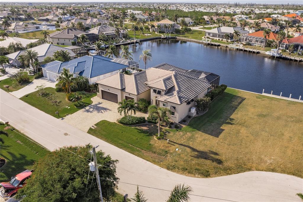 an aerial view of a house with a lake view