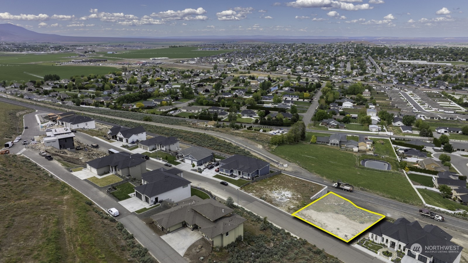 an aerial view of a city with lawn chairs