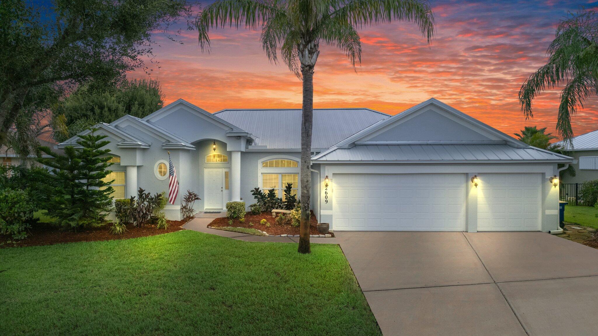 a front view of house with yard and outdoor seating