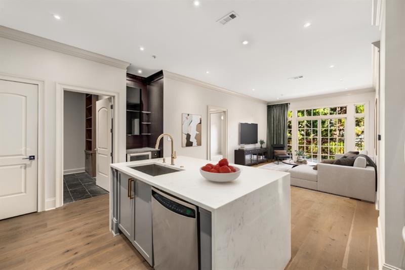 a kitchen with a sink stove and cabinets