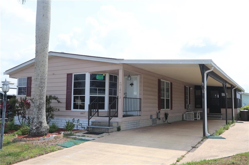 a front view of a house with a patio