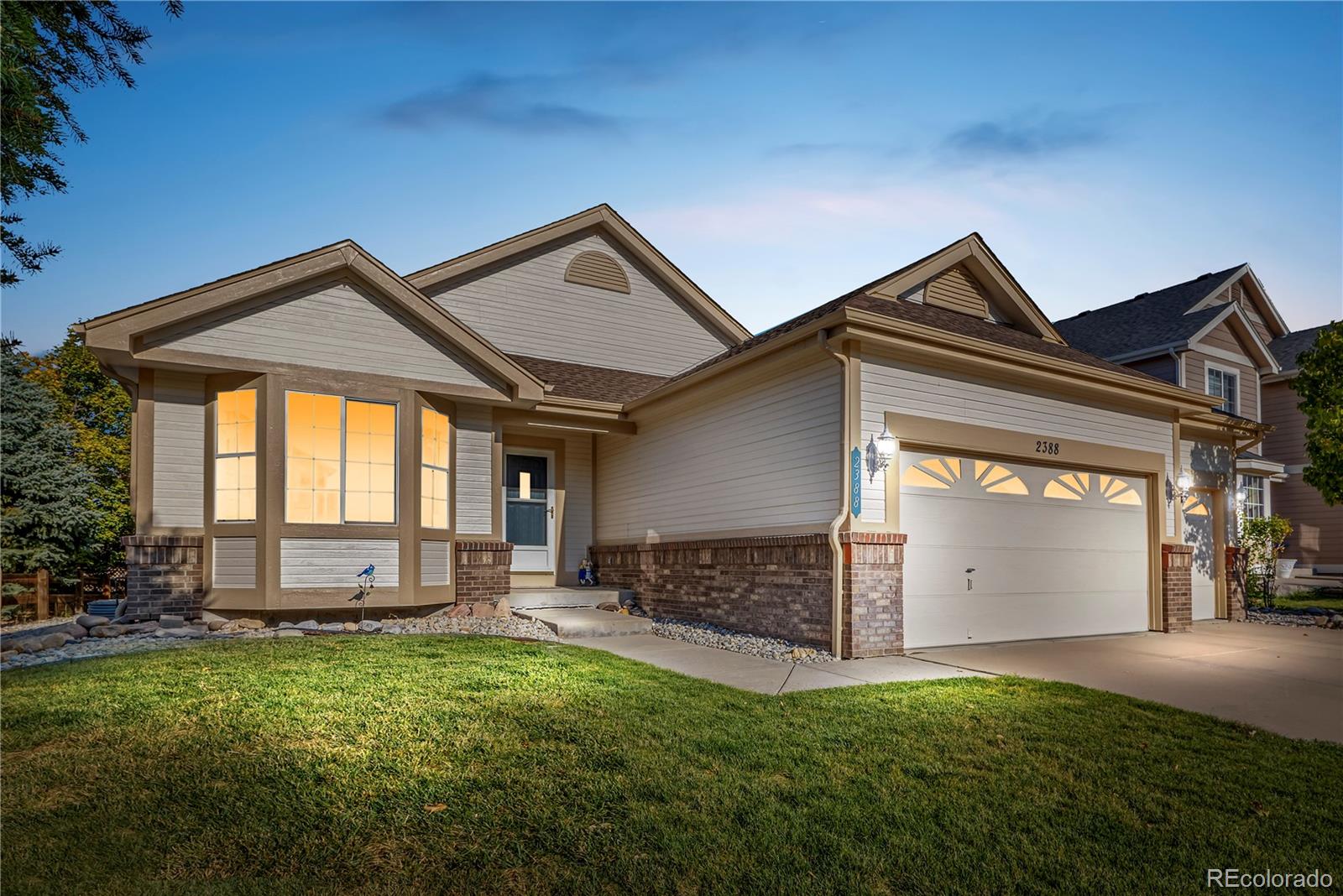 a front view of a house with a yard