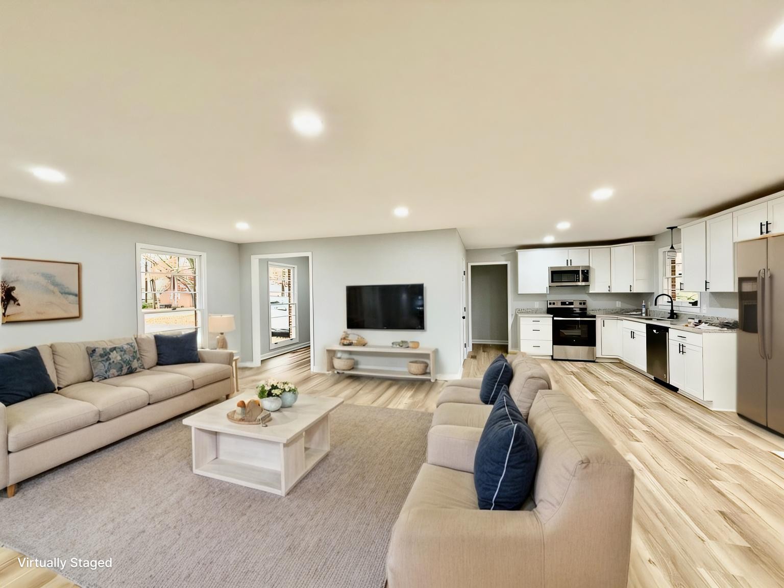 a living room with furniture and a flat screen tv