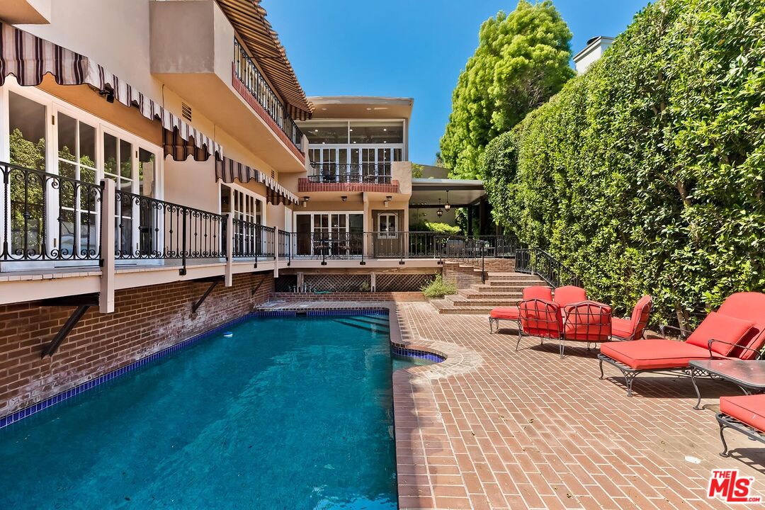 a view of pool with outdoor seating