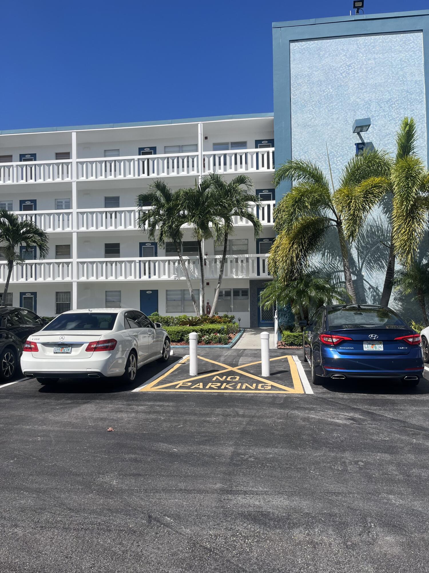 a view of a car park in front of a building