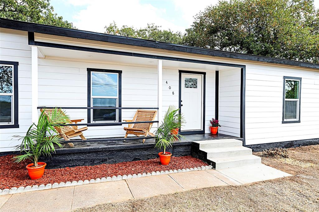 front view of a house with a patio