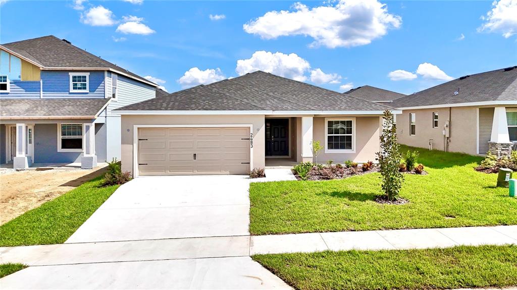 a front view of a house with a yard