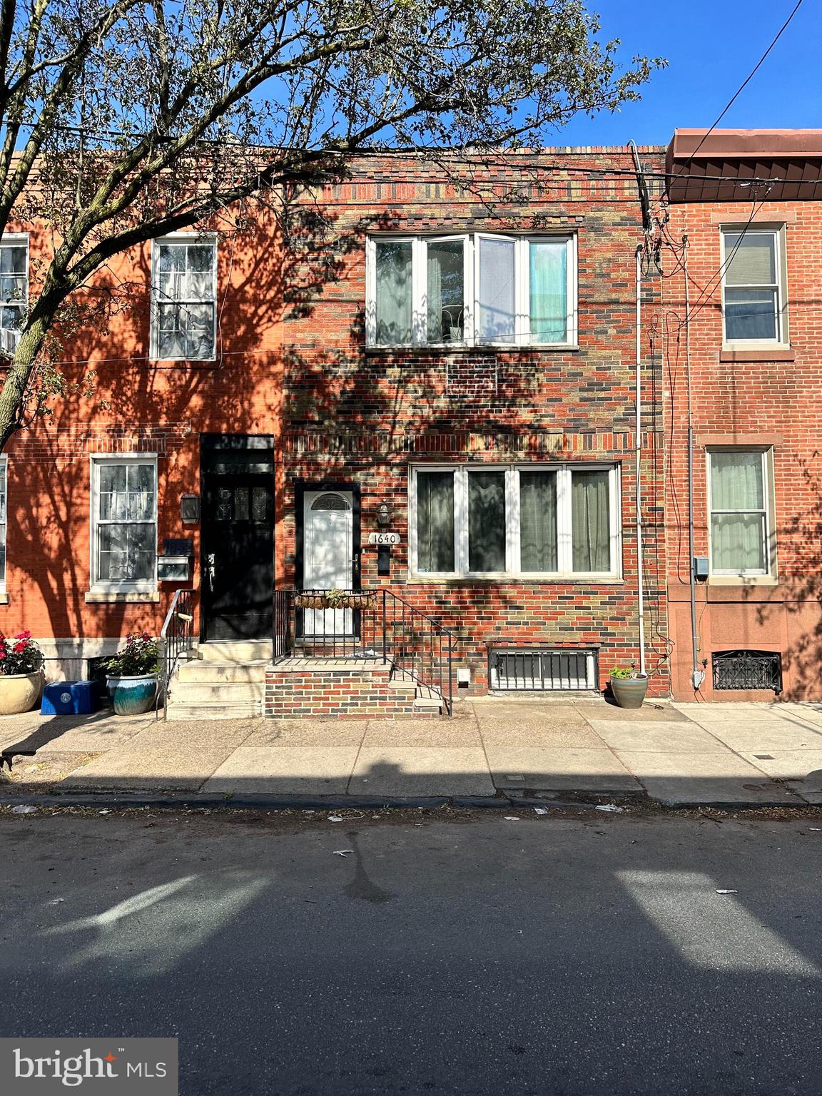 a front view of a building with street view