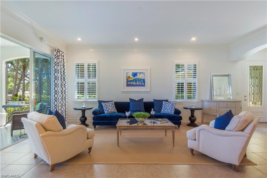 a living room with furniture and windows