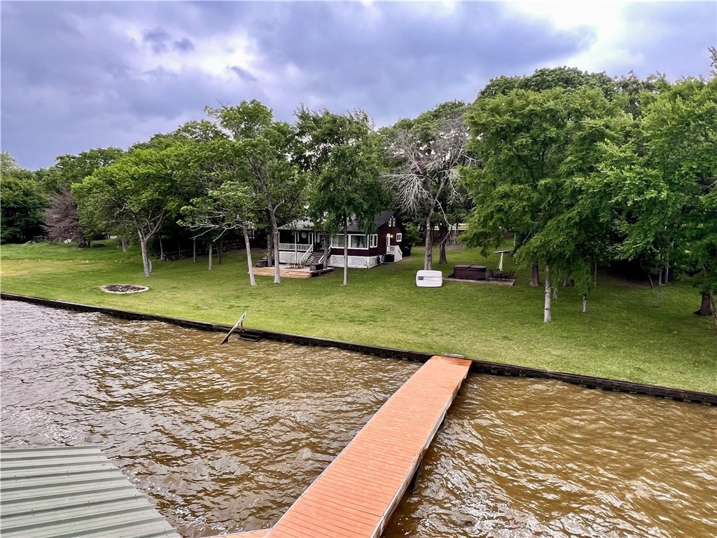 a view of a swimming pool with a yard